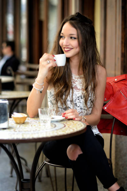 istock Smiling girl drink a coffee 667205598