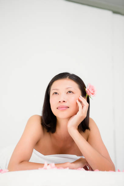 Relaxed woman on the massage table at the health spa