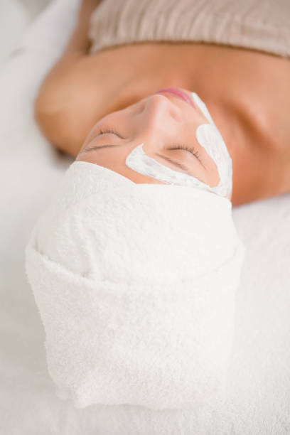 istock Attractive woman with cream treatment 667206392
