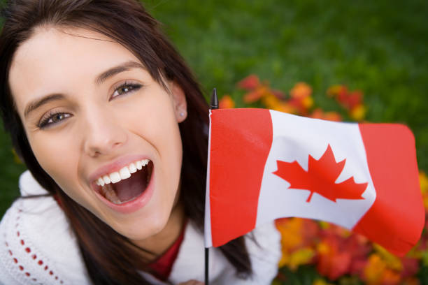 istock Smiling teenager holding canada flag 667207826
