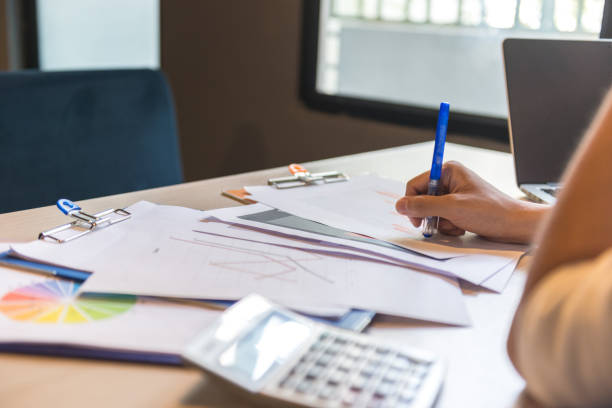 istock Reading sales report and thinking about new ideas for his business 667218700