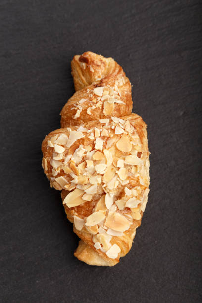 istock breakfast croissant on a black background 667218790