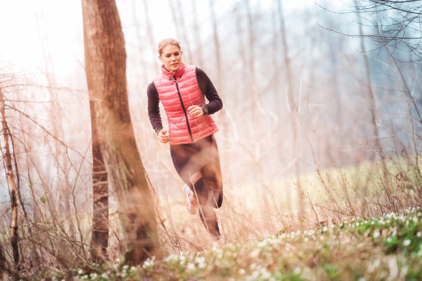 istock Stunning Young Woman Jogging at Sunrise 667221920