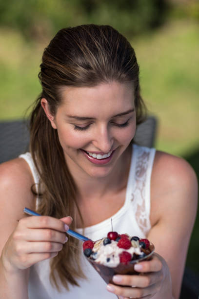 istock Smiling woman holding dessert 667225024
