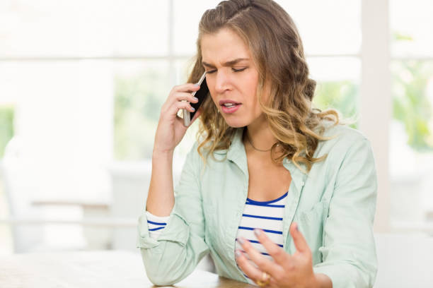 istock Frowning woman having phone call 667229418