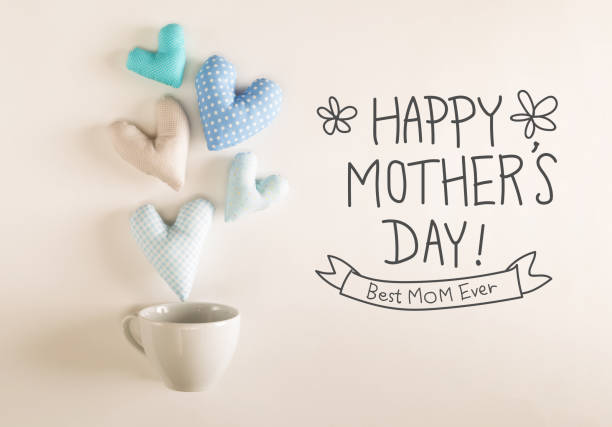 istock Mother's Day message with blue heart cushions 667230024