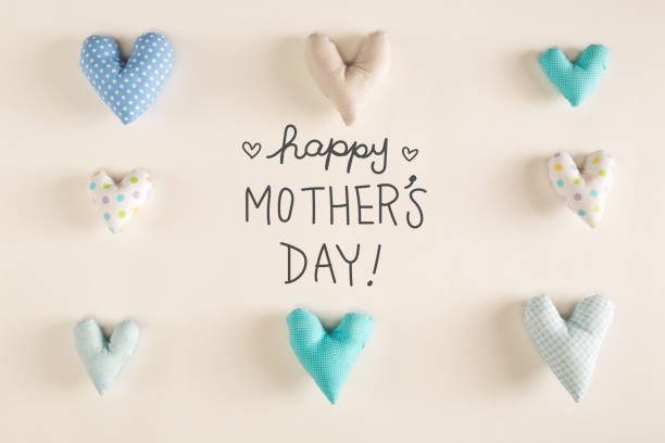 istock Mother's Day message with blue heart cushions 667230040