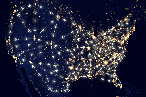 USA United States of America air traffic represented by a Nasa night map of lights and planes with course line network. For this image creation Adobe Photoshop was used, as well as a NASA map. Link https://www.nasa.gov/sites/default/files/images/712129main_8247975848_88635d38a1_o.jpg