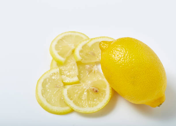 lemons - vibrant color part of full studio shot stock-fotos und bilder
