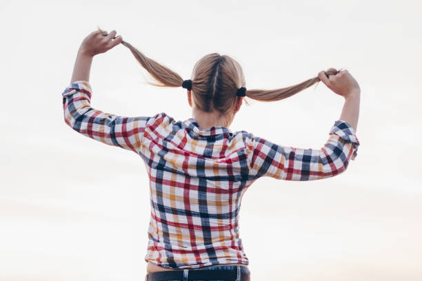 istock Young girl looking in the beautiful sky 667233430