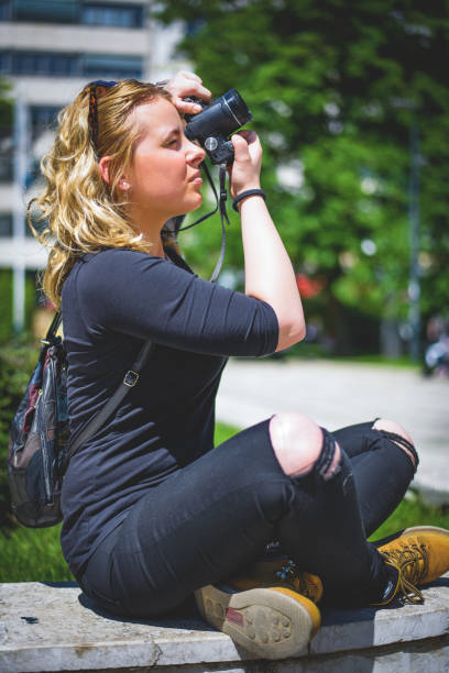 istock Young woman taking picture with your ceamera 667233544