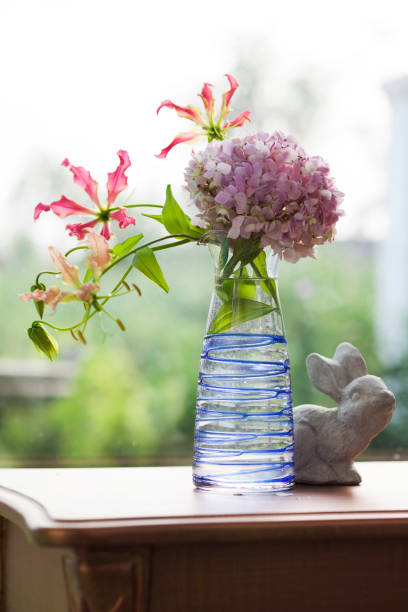 istock Climbing Lily and Hydrangea in jar for decoration 667234404