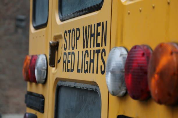 stop lights yellow school bus - vehicle door flash imagens e fotografias de stock