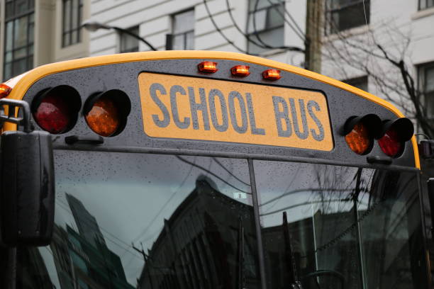 istock Yellow school bus city reflations 667236688