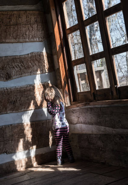 istock Lonely small baby girl in empty cabin 667240058