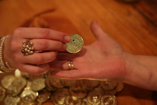 istock Putting golden coin into palm 667247552