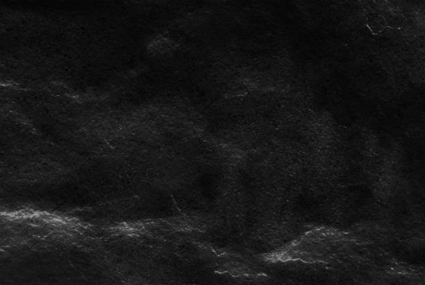 istock Black stone pattern texture background, Detailed of real genuine stone from nature 667248480