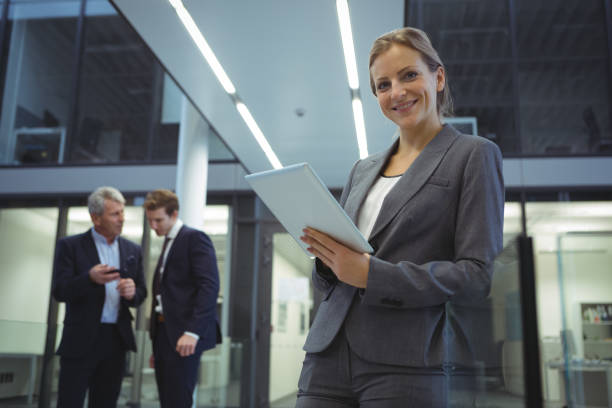 istock Businesswoman using digital tablet at office 667255960