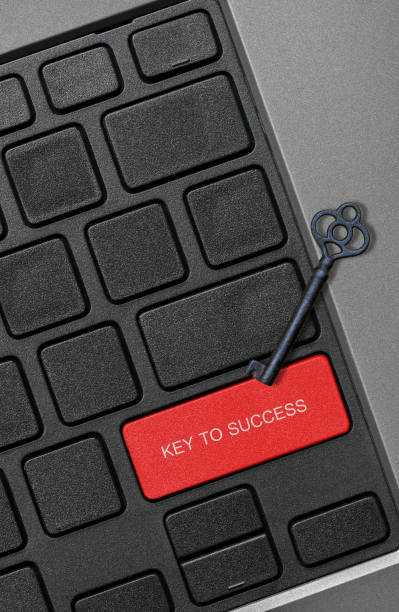 istock Old key on keypad with word KEY TO SUCCESS on red button 667256984