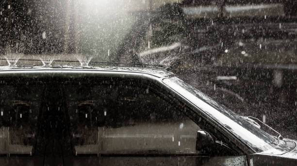 istock heavy rai on vintage car roof 667259332