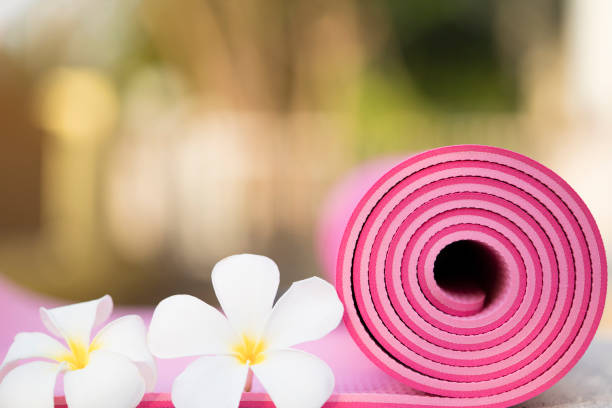 istock pink yoga mat and a flowers 667259572