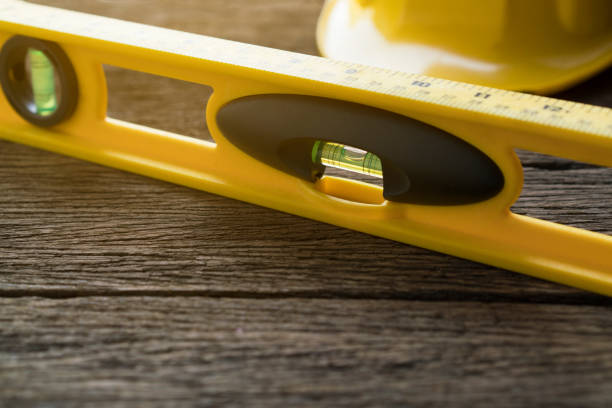 Yellow building levels on old wood table