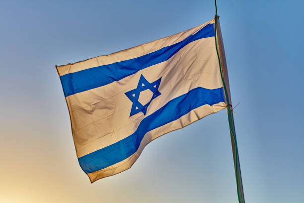 istock Israel flag at sunset 667260562