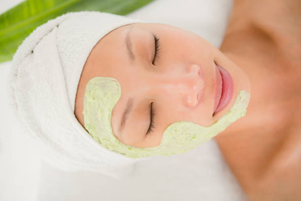istock Beautiful brunette getting a facial treatment 667263082