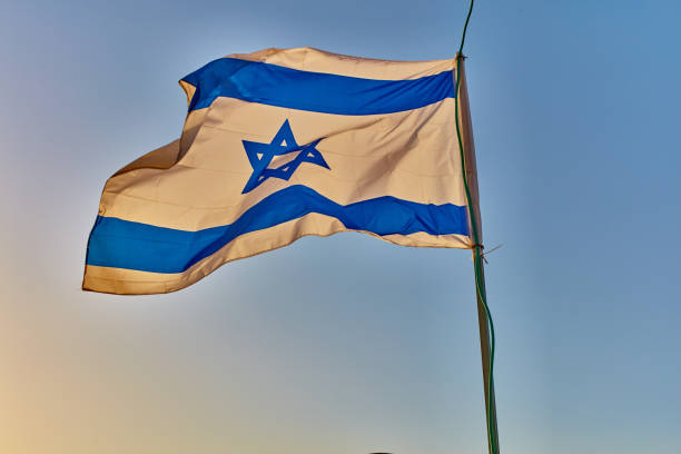 istock Israel flag at sunset 667266684