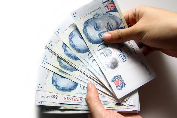 Singapore Dollars bank notes The Singaporean dollar is the official currency of Singapore. It is normally abbreviated with the dollar sign singapore cash stock pictures, royalty-free photos & images