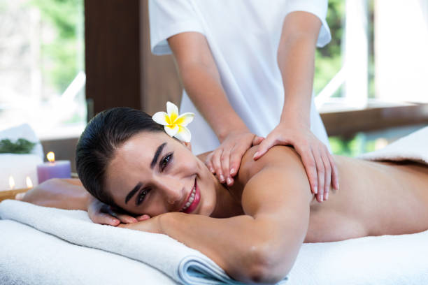 istock Masseuse giving massage to relax woman 667270458