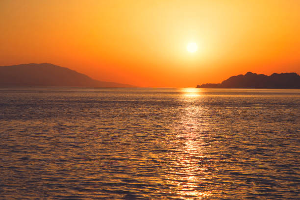 Beautiful sunset over gulf in the sea, Loutraki, Greece. Vintage style.