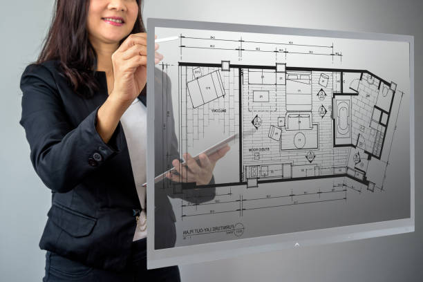 istock Businesswoman (Architect / Interior designer) working with virtual layout home 667274488