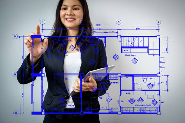 istock Businesswoman (Architect / Interior designer) working with virtual layout home 667274676