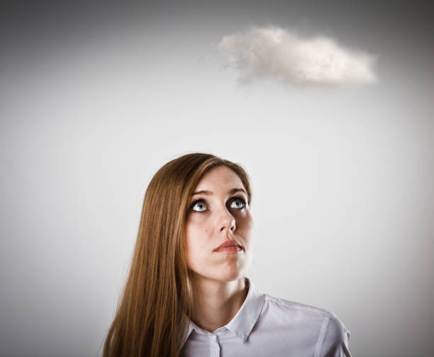 istock Woman in white and cloud. Imagination concept. 667281066