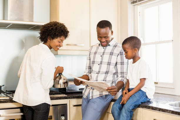 istock Family reading in the kitchen 667286014