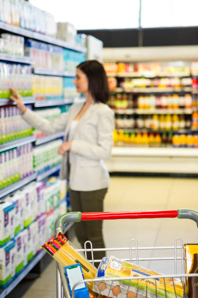 istock Woman looking at product in aisle 667288934