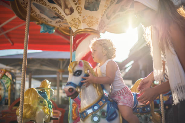 istock Happy Boy and Mother on Carousel 667292356