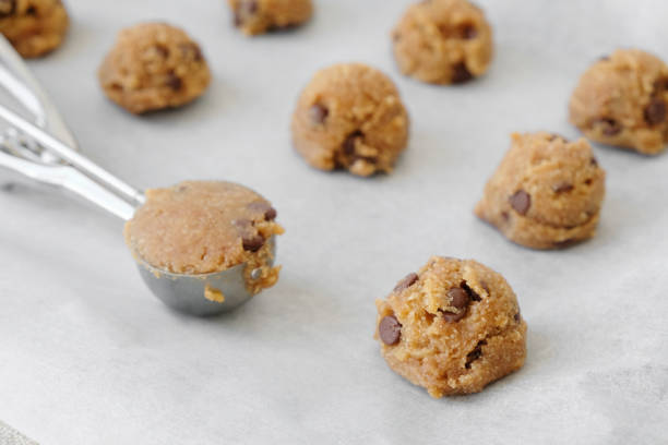 istock chocolate chip cookie dough with ice cream scoop 667293190