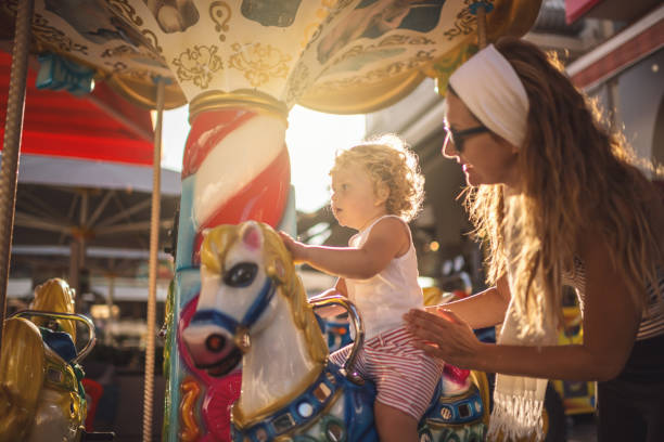 Happy Boy and Mother on Carousel