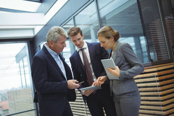 istock Business executives discussing over digital tablet 667296162