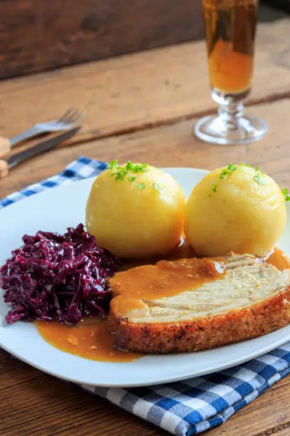 hearty roast pork with dumplings and red cabbage