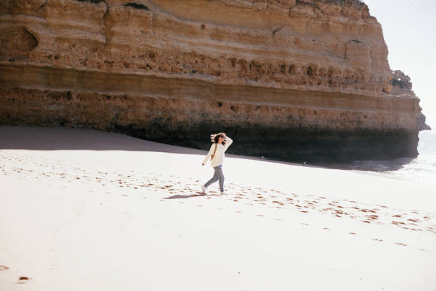 istock young woman spending happy time on the seaside 667297072
