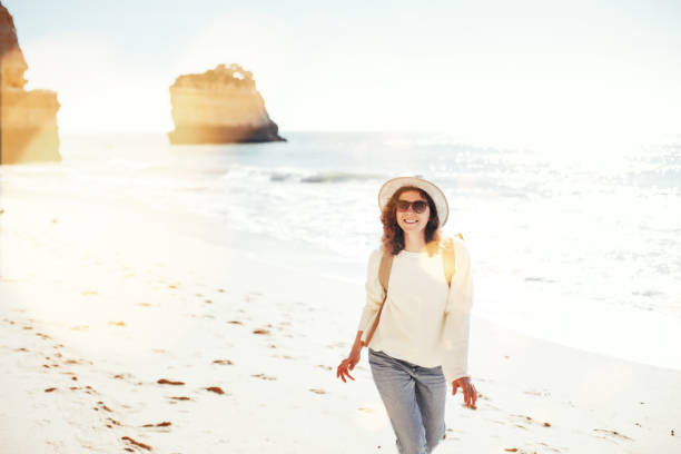 istock young woman spending happy time on the seaside 667297090