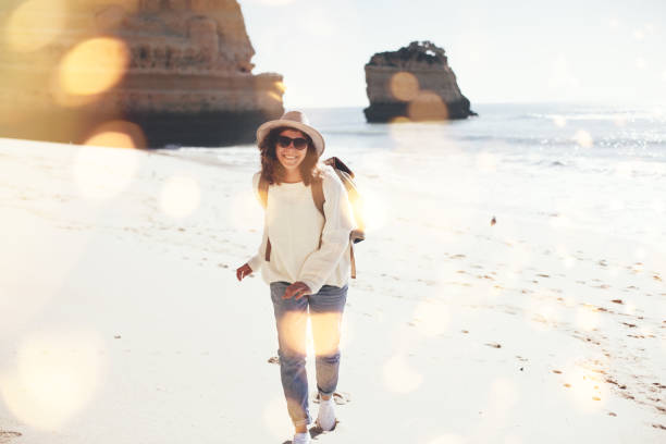 istock young woman spending happy time on the seaside 667297130