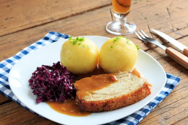 hearty roast pork with dumplings and red cabbage