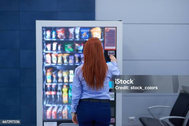 Buying Something In The Airport Stock Photo - Download Image Now - Vending Machine, Snack, Airport
