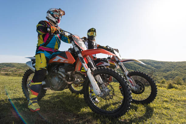 istock Two motocross riders on their bikes in nature. 667300660