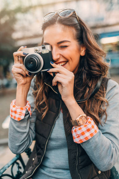 istock Young female photographer 667301042