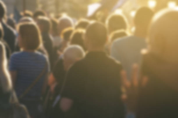 Defocused crowd attending political meeting, large group of people Defocused crowd attending political meeting, large group of unrecognizable people as audience to politician's speech outdoors peace demonstration photos stock pictures, royalty-free photos & images